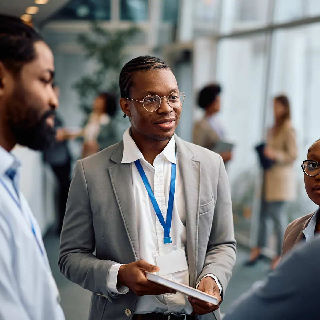 Attendees networking at a business event