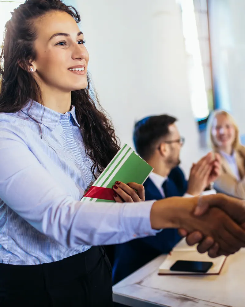 Client handshake at a business meeting